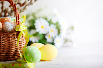 Happy Easter. Congratulatory easter background. Easter eggs and flowers.