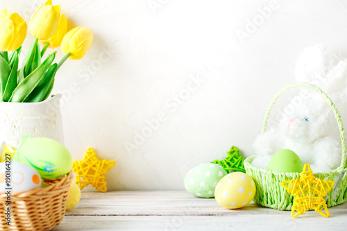Happy Easter. Congratulatory easter background. Easter eggs and rabbit.