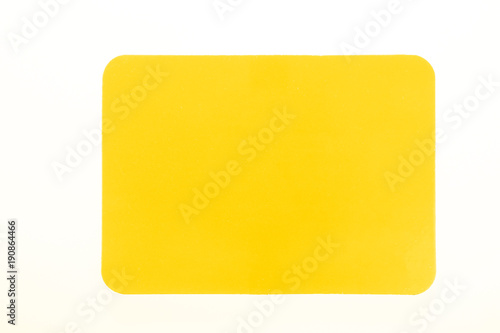 Yellow card isolated on white for sport concept