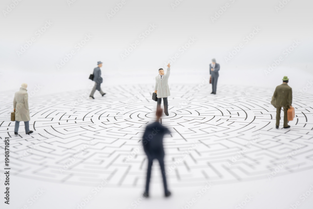 Miniature toy:Business man success but other still find the way to success.Business obstacle,financial,business growth concept. Miniature toy:Business man success but other still find the way to success.Business obstacle,financial,business growth concept.