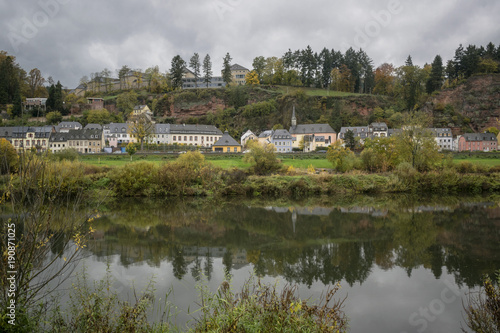 Detail of Moselle river valley with typical village houses near Trier in rainy day in November, Germany. Dark autumn landscape. © abyrvalg_00