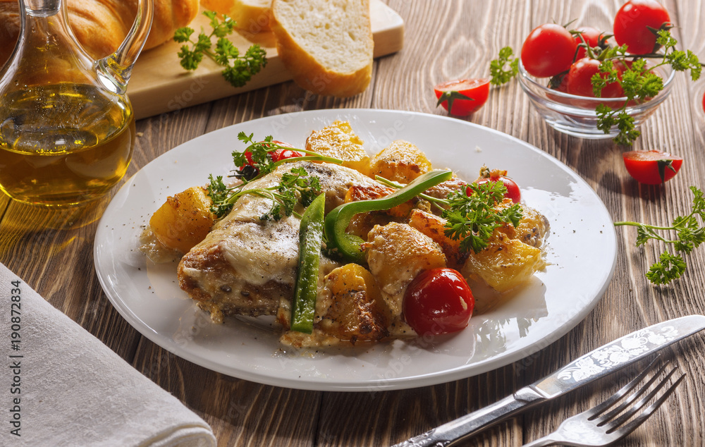 Chicken with potatoes, baked in the oven. Chicken with potatoes, baked in the oven.