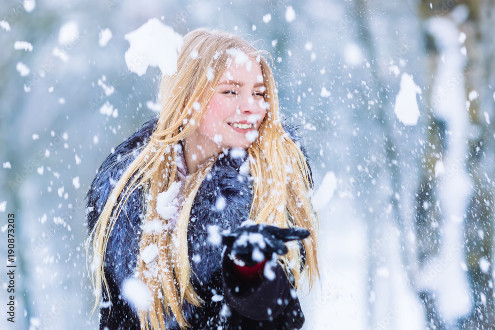 Winter young teen girl portrait. Beauty Joyful Model Girl laughing and having fun in winter park. Beautiful young woman outdoors. Enjoying nature, wintertime Winter young teen girl portrait. Beauty Joyful Model Girl laughing and having fun in winter park. Beautiful young woman outdoors. Enjoying nature, wintertime