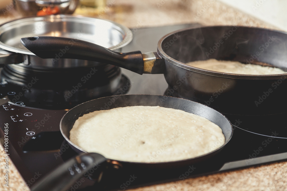 White pancake fry in pan White pancake fry in pan
