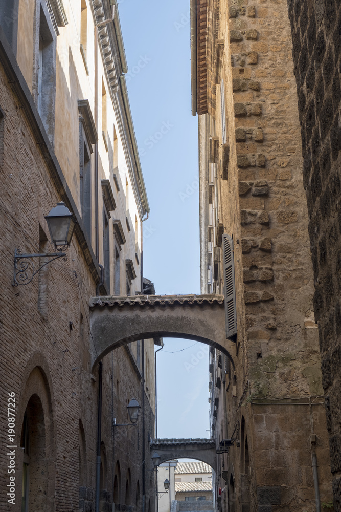 Orvieto, Umbria, Italy: historic street with arches