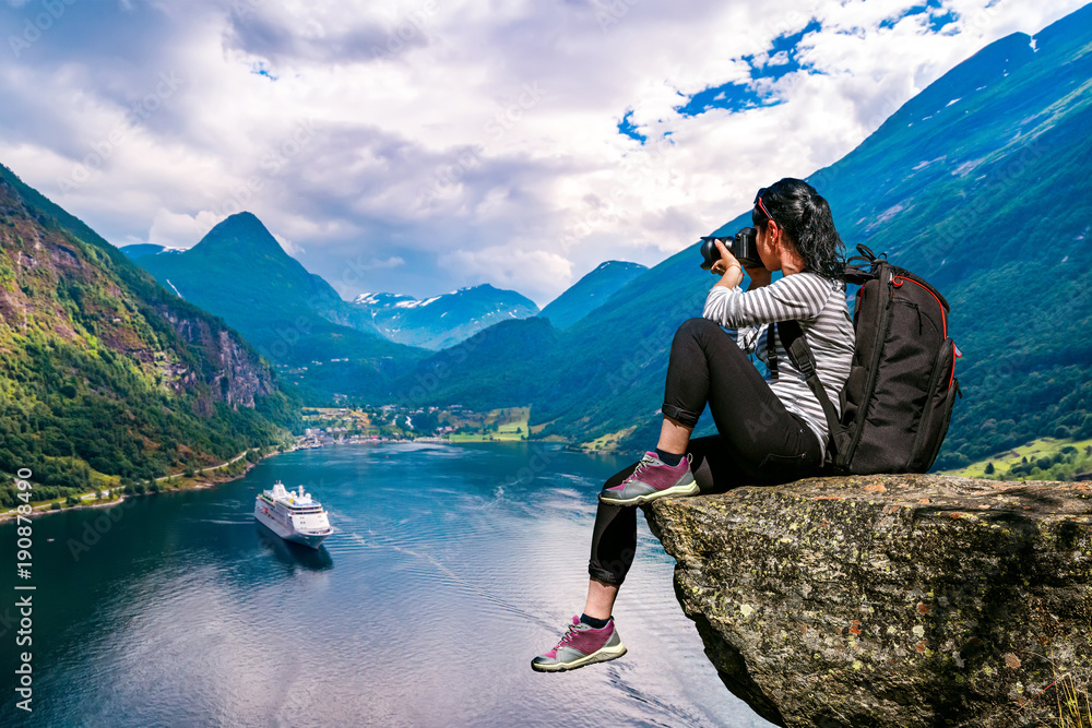 Geiranger fjord, Beautiful Nature Norway panorama. Nature photographer tourist with camera shoots. - obrazy, fototapety, plakaty 