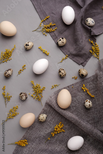 Eggs with flowers and decorative elements on concrete.