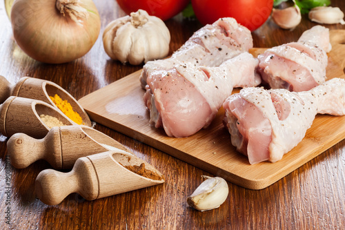 Fototapeta Naklejka Na Ścianę i Meble -  Raw chicken legs with spices