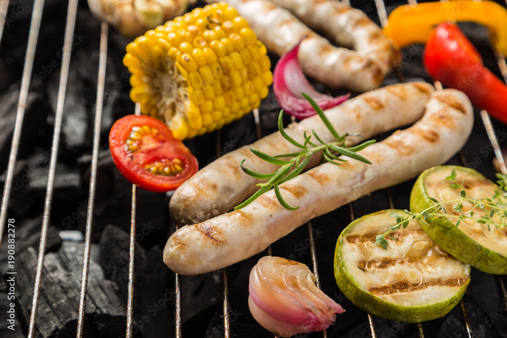 Preparing grilled sausage and vegetables Preparing grilled sausage and vegetables