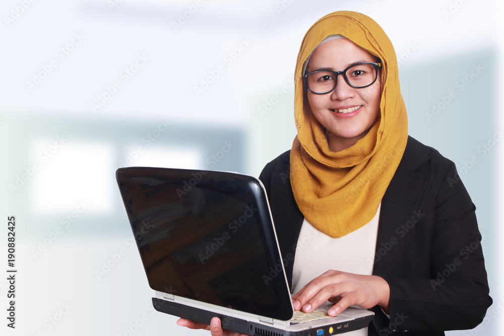 Muslim Businesswoman with Laptop Muslim Businesswoman with Laptop