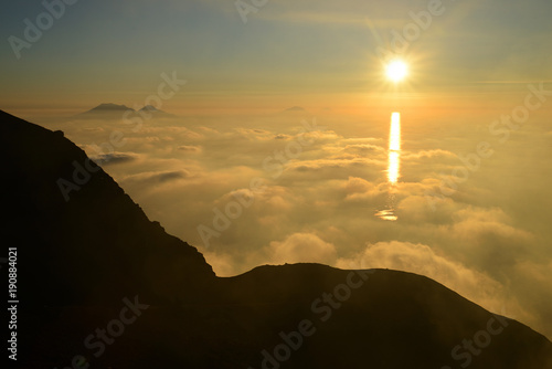 Spectacular sunset over the Aeolian Islands seen from the summit of Volcano Stromboli, Sicily, Italy photo