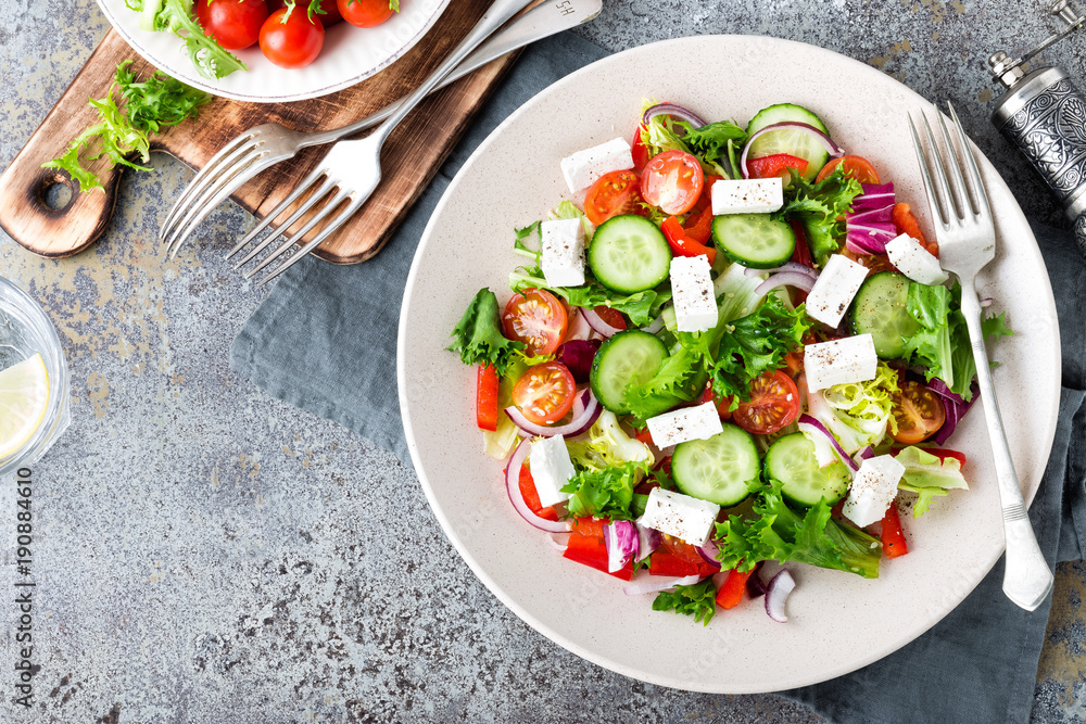 Fresh vegetable salad with feta cheese, fresh lettuce, cherry tomatoes, red onion and pepper Fresh vegetable salad with feta cheese, fresh lettuce, cherry tomatoes, red onion and pepper