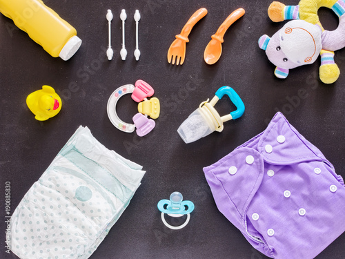 Flat lay of baby set with cloth diaper photo