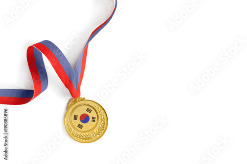 Gold medal on white background as a symbol of victory in sports competition in South Korea