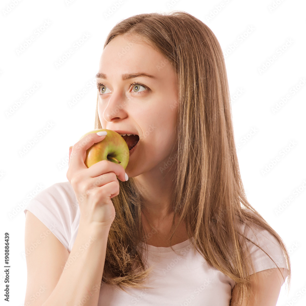 Beautiful young smiling woman holding an apple in her hands Beautiful young smiling woman holding an apple in her hands