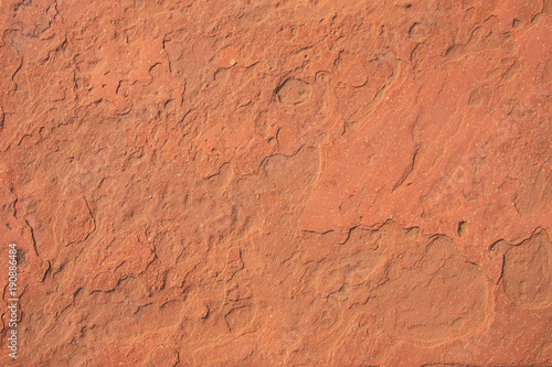 Red laterite stone surface texture background. photo