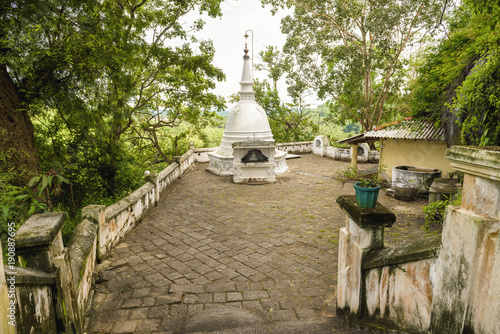 Ancient Buddhist rock temple in Mulkirigala, Sri Lanka photo