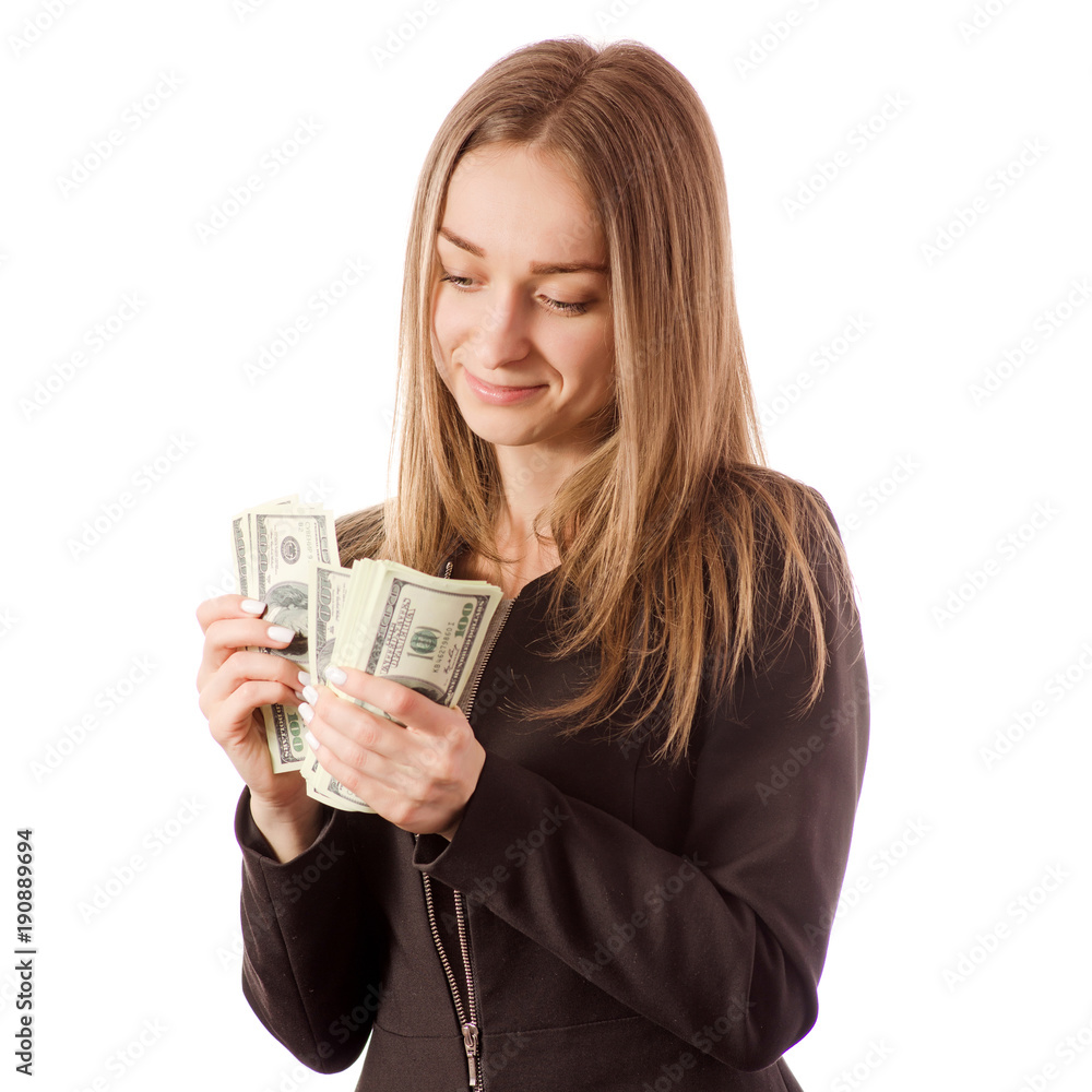 Beautiful young woman in the hands counts money dollars Beautiful young woman in the hands counts money dollars
