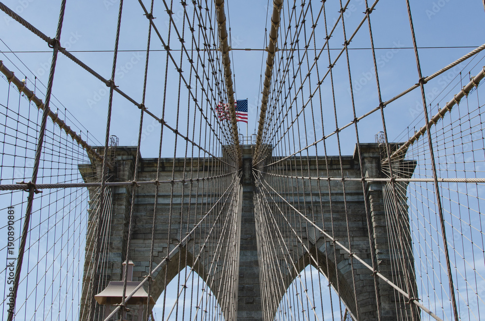 Obraz premium Brooklyn Bridge with American flag
