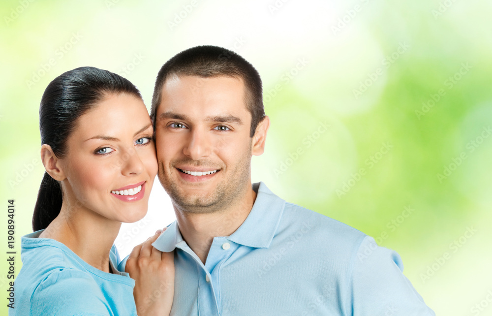 Young happy smiling attractive couple, outdoors Young happy smiling attractive couple, outdoors