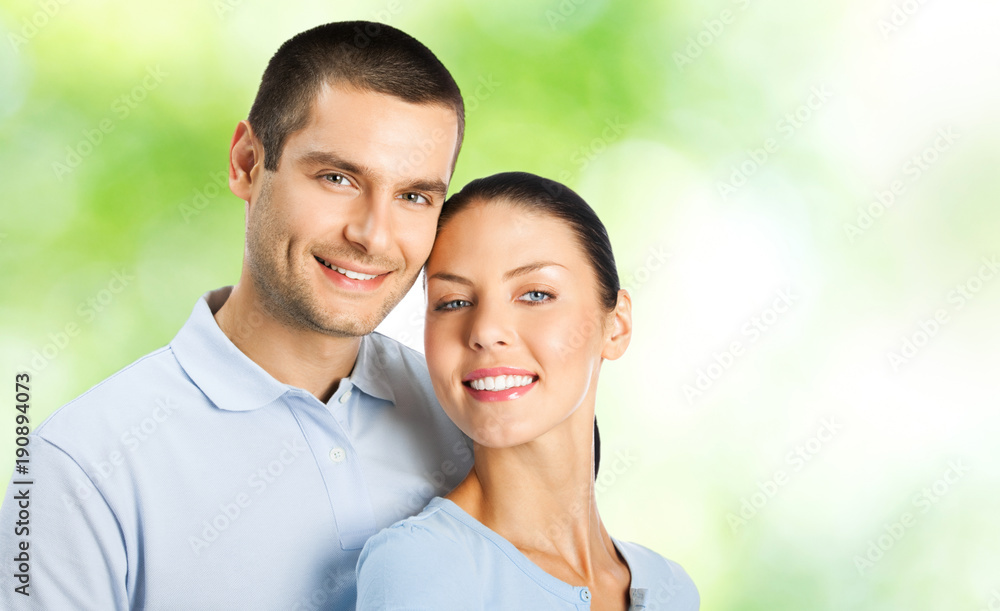 Fototapeta premium Young happy smiling attractive couple, outdoors