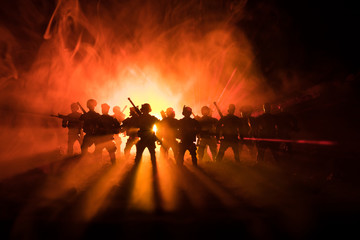 Anti-riot police give signal to be ready. Government power concept. Police in action. Smoke on a dark background with lights. Blue red flashing sirens. Dictatorship power