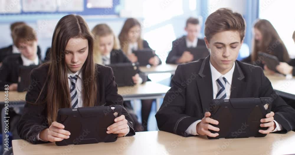 4k, Teenage school children with digital tablets in classroom 4k, Teenage school children with digital tablets in classroom