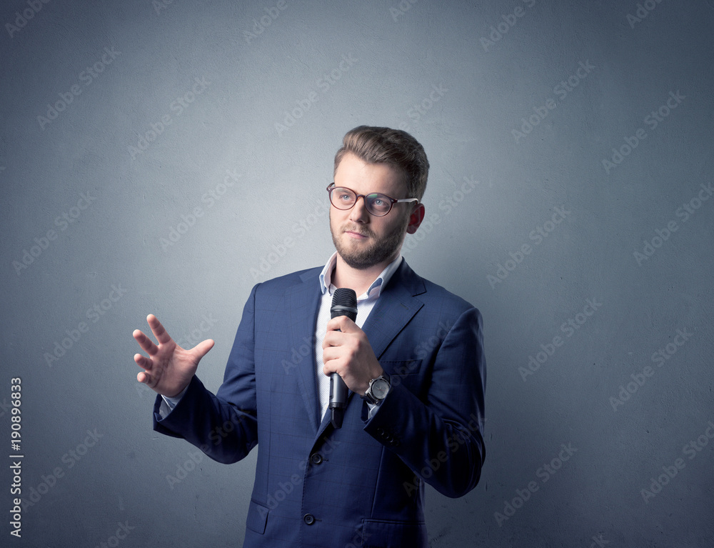 Businessman holding microphone Businessman holding microphone