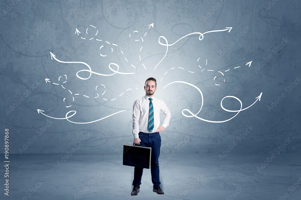 Businessman standing with winding arrows around Businessman standing with winding arrows around