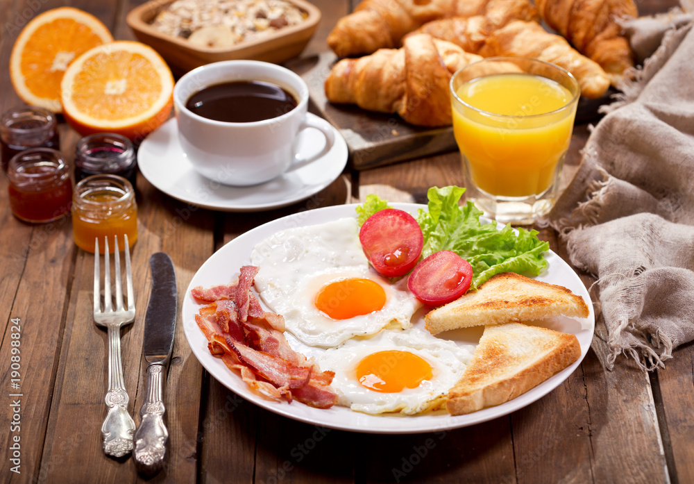 breakfast with fried eggs, coffee, juice and fresh fruits breakfast with fried eggs, coffee, juice and fresh fruits