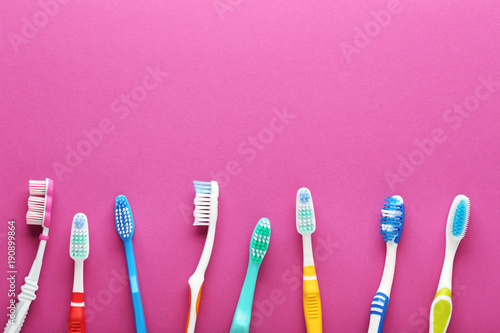 Toothbrushes on pink background