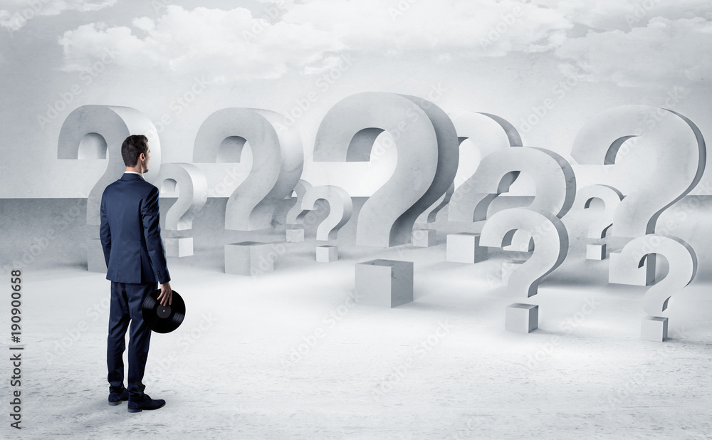 Man with lot of question mark signs and icons Man with lot of question mark signs and icons
