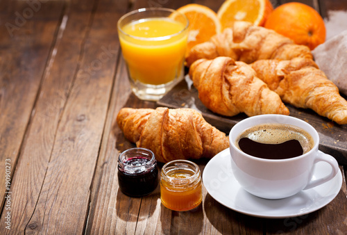 Fototapet breakfast with cup of coffee and croissants