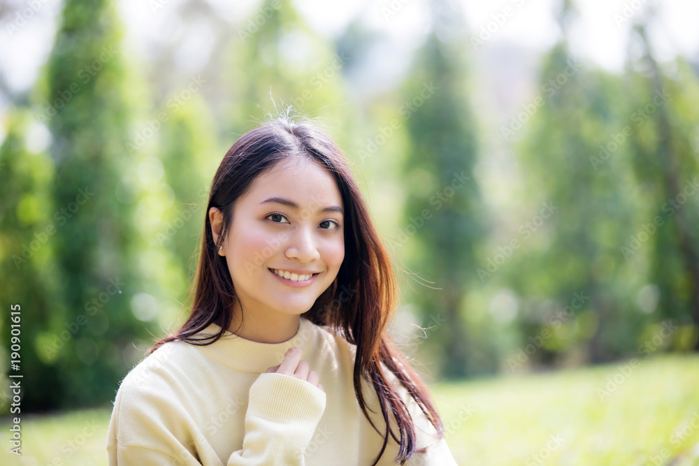 Beautiful Asian woman Smiling happy girl and wearing warm clothes winter and autumn portrait at outdoor in park Beautiful Asian woman Smiling happy girl and wearing warm clothes winter and autumn portrait at outdoor in park
