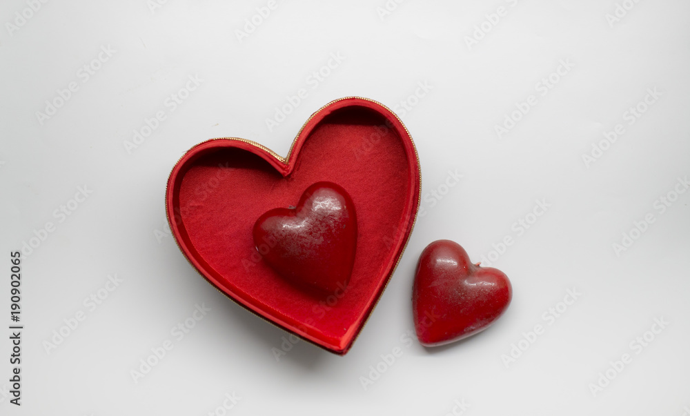 Two heart shaped figurines and a box