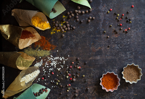 Different food spices on a dark surface