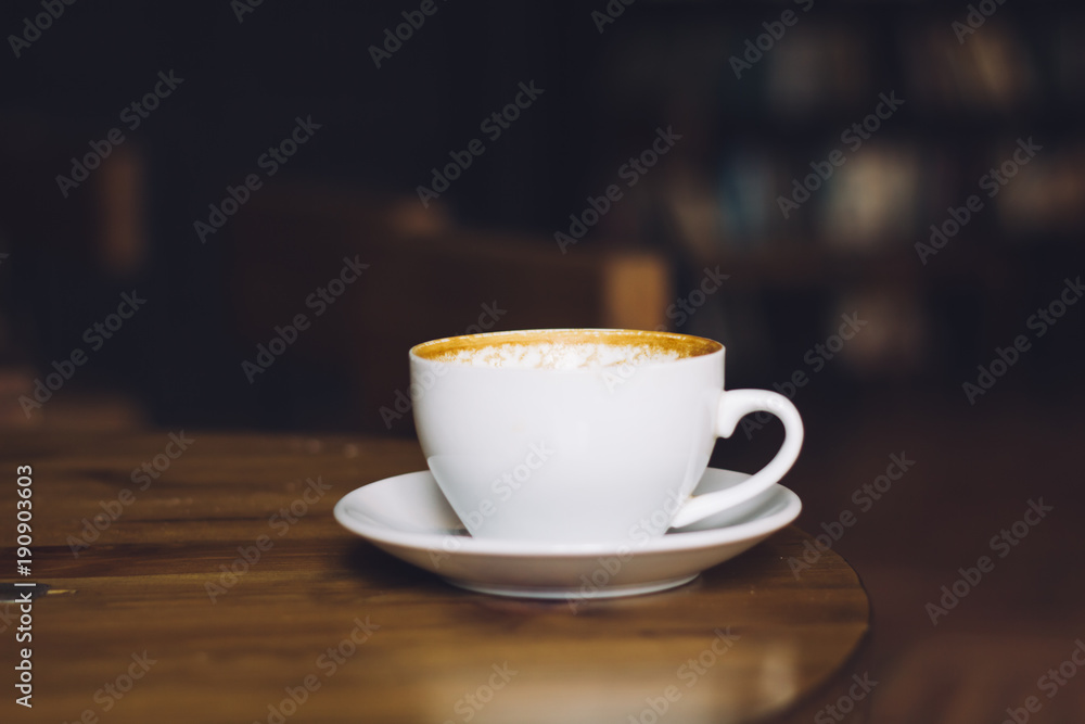Empty cup of coffee on wooden table background. profile view. copy space.
