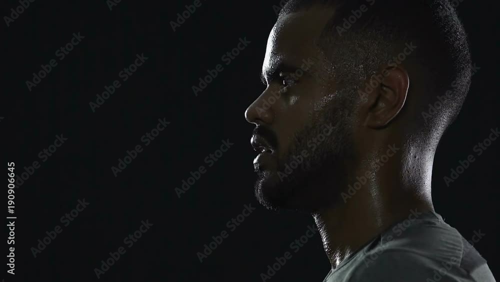 Sweaty hispanic sportsman looks serious after game, strong champion character Sweaty hispanic sportsman looks serious after game, strong champion character