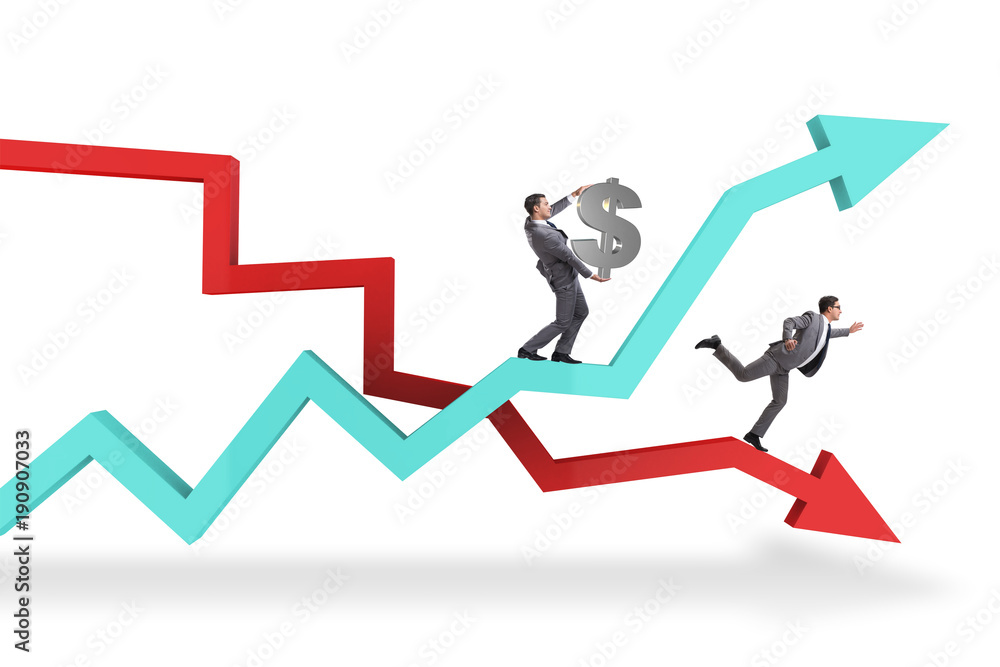 Businessman with charts of growth and decline Businessman with charts of growth and decline