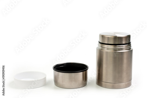 Lightweight, metallic thermos for eating with a plastic plate on a white background