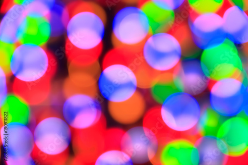 Texture from the blurred multicolored circles in bokeh style for design. Defocused lights of the city.