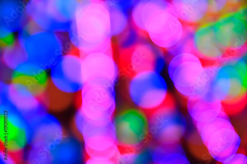 Texture from the blurred multicolored circles in bokeh style for design. Defocused lights of the city.