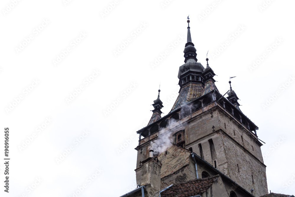 Close up of Sighisoara's clock tower with white background