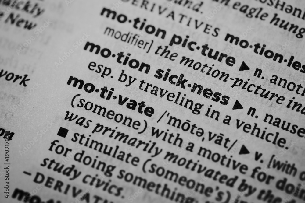 Mcro shot of word definition: Motivate Mcro shot of word definition: Motivate