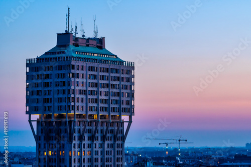 Cityscape of Milan (Italy): The famous skyscraper called Torre Velasca, built in the 50s; sunset view. photo