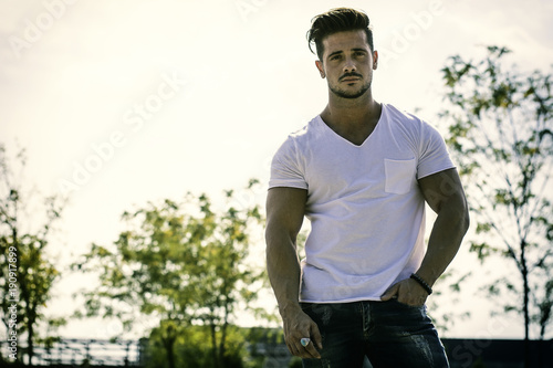 Attractive muscular man in city park in a nice summer day © theartofphoto