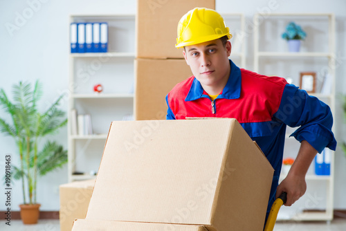 Young man working in relocation services with boxes