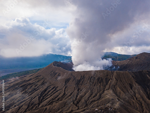 Mount Bromo (Gunung Bromo) active volcano crater and part of the Tengger massif. Aerial top view from drone. East Java, Indonesia