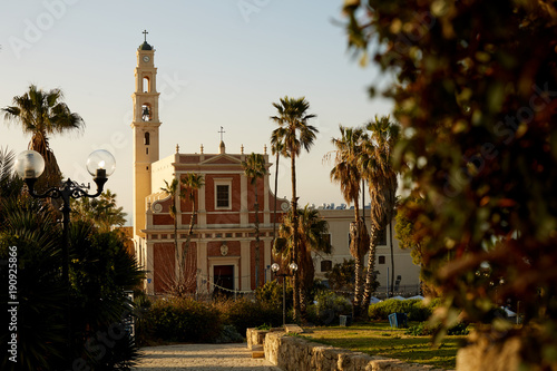 The hilly Abraham Shechterman's garden overlooks the main city landmarks, such as St Peter's church, located in Kedumim Square, Jaffa, Tel Aviv, Israel. photo