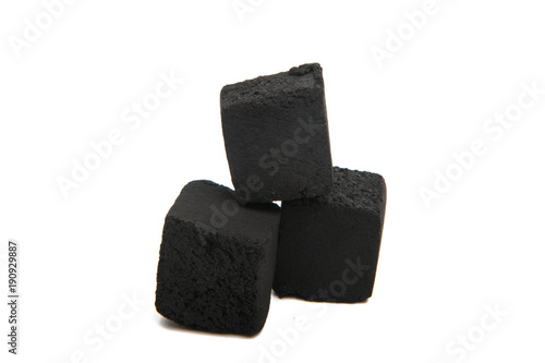 Cubes of coconut coal for a hookah on a white background.